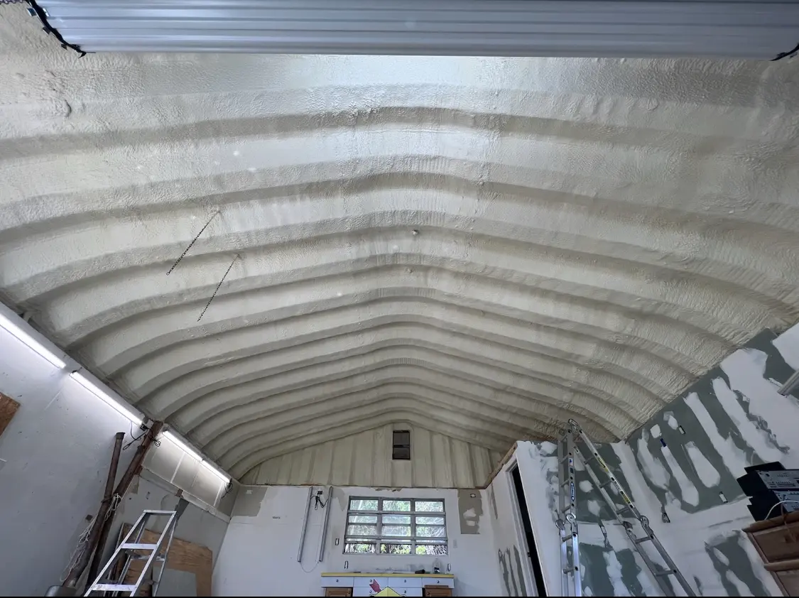 Spray polyurethane foam applied to the underside of a metal roof deck in West Frankfort